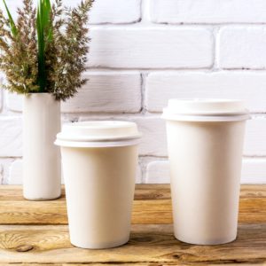 Paper coffee cups mockup with cord wild grass